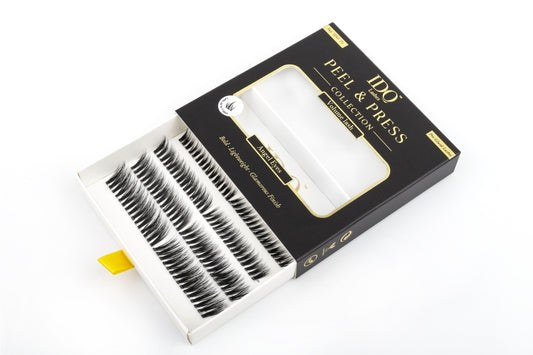 Eyelash packaging with false eyelashes on a white background