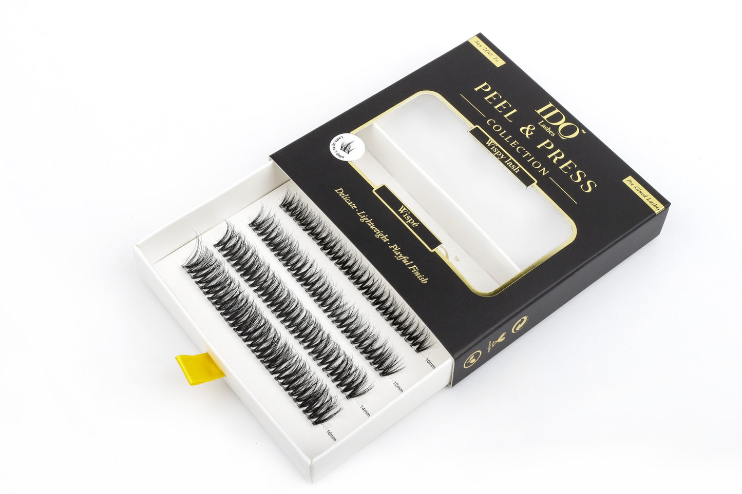 Box of false eyelashes with 'Peel & Press' branding on a white background
