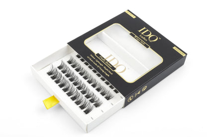 Open box of false eyelashes with 'IDO' branding on a white background