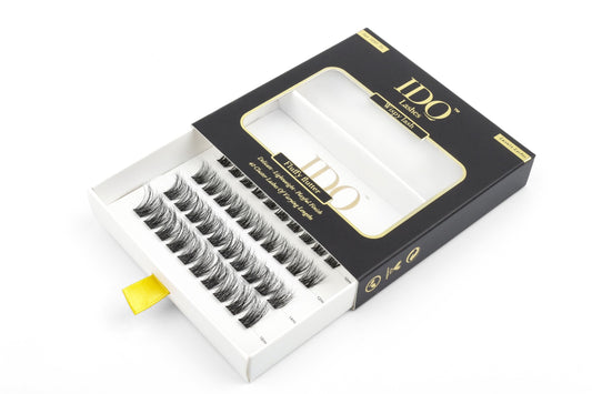 Open box of false eyelashes with 'IDO' branding on a white background