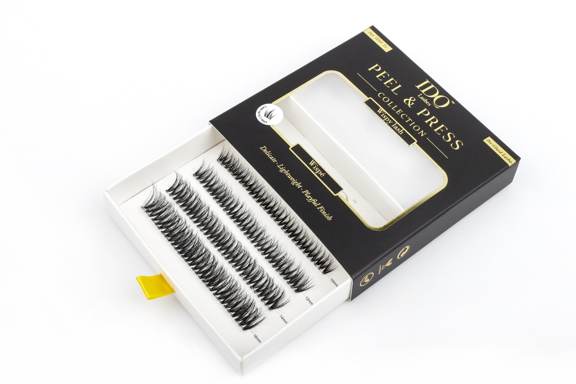 Box of false eyelashes with 'Peel & Press' branding on a white background