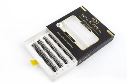 Box of false eyelashes with 'Peel & Press' branding on a white background